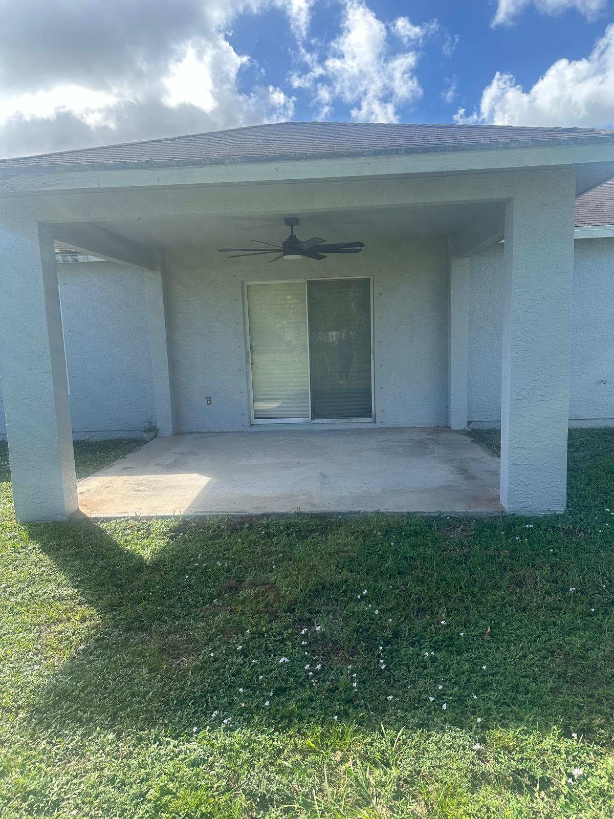 4397 Southwest Calah Circle Port St. Lucie, FL 34953 - Photo 8 of 10 a view of a big room with a fireplace