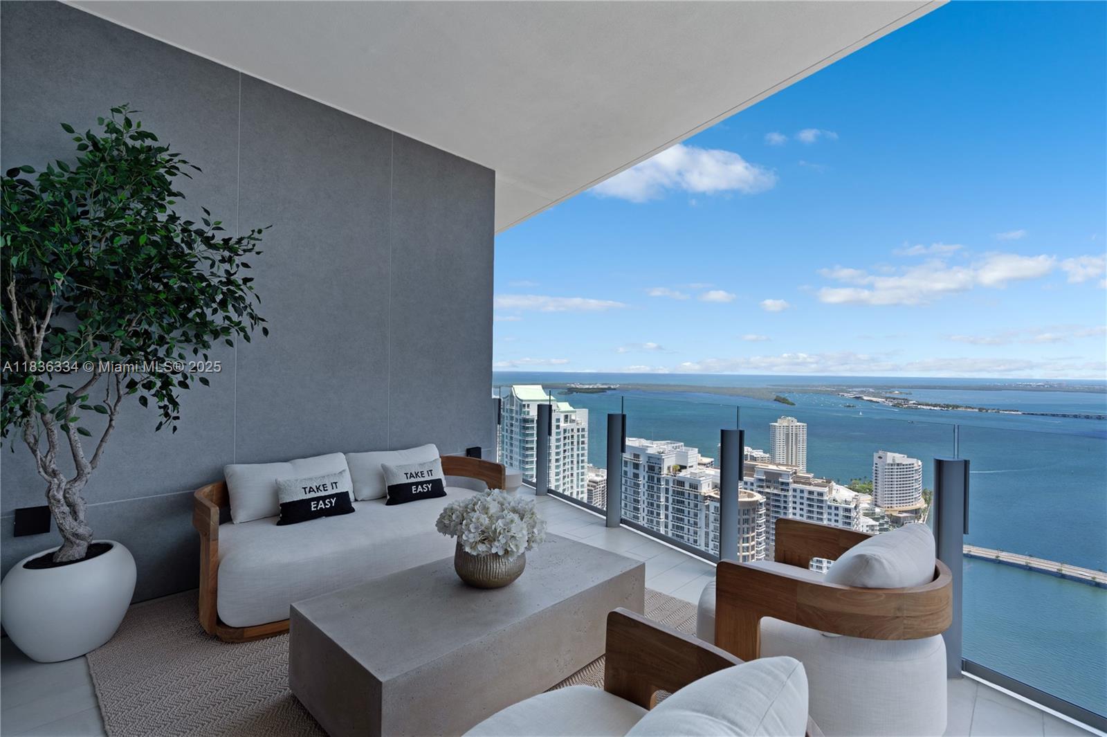 300 Biscayne Blvd Way, Unit 4707 Miami, FL 33131 - Photo 8 of 21 a living room with furniture and a potted plant