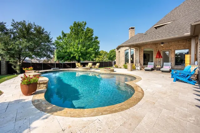a view of a swimming pool with a patio
