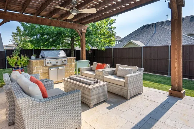a outdoor living space with furniture and garden view