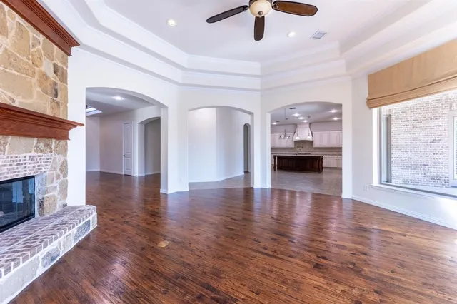 a view of livingroom with kitchen and fireplace