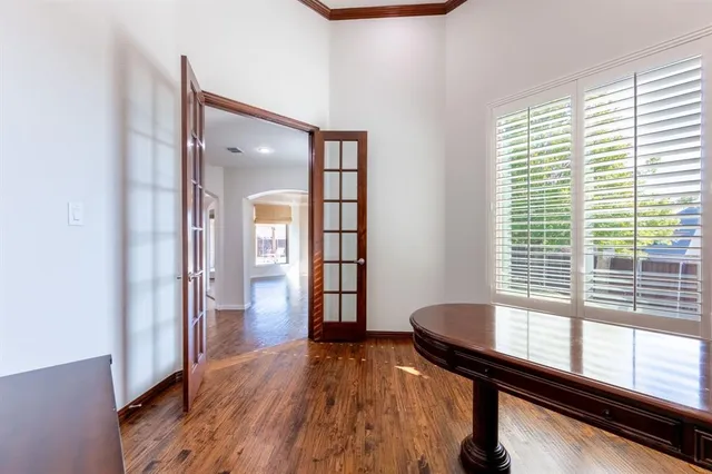 a view of a room window and wooden floor