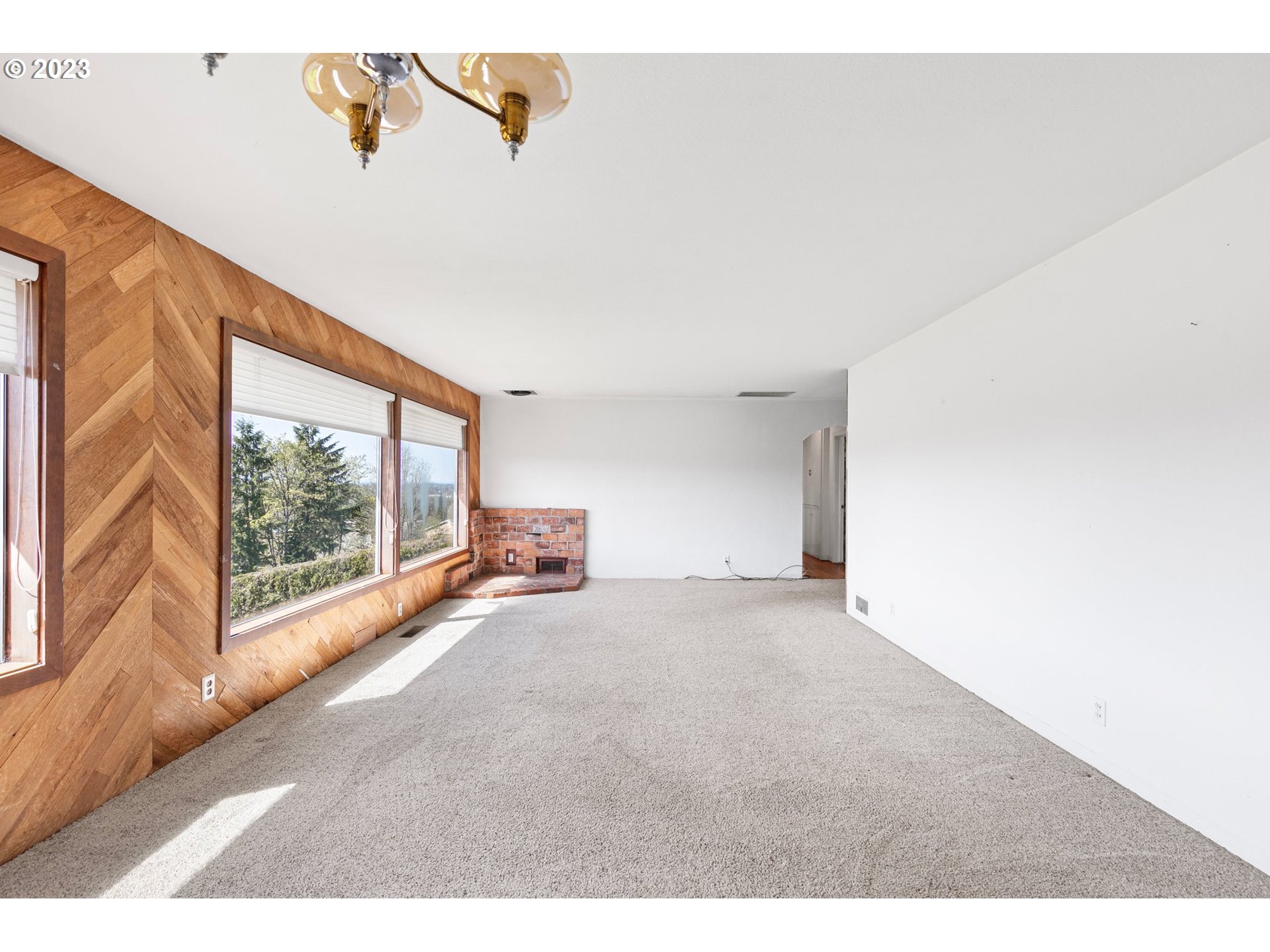 734 Summit Boulevard Springfield, OR 97477 - Photo 13 of 41 a view interior of a house with wooden floor and windows