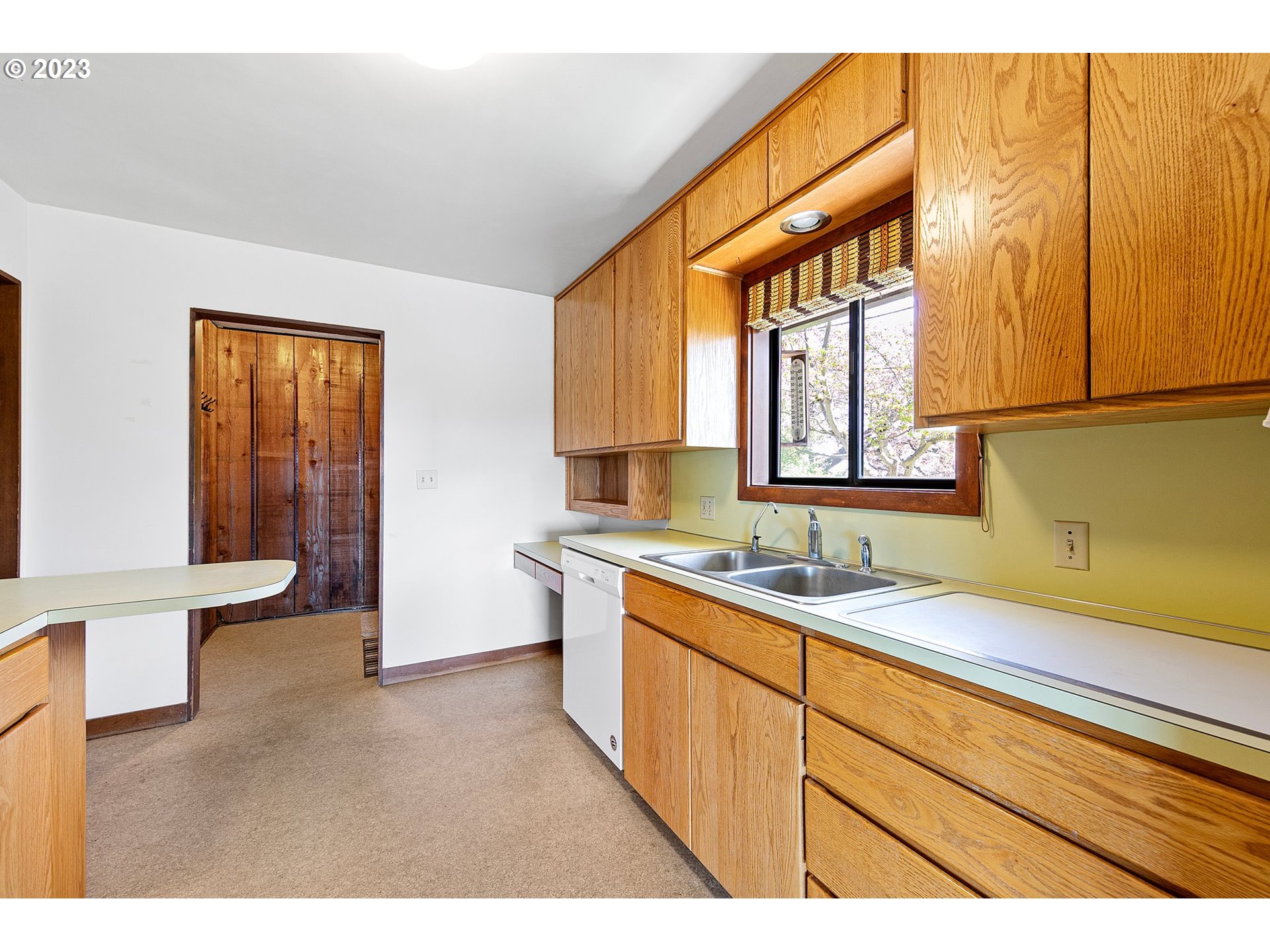 734 Summit Boulevard Springfield, OR 97477 - Photo 20 of 41 a view of a kitchen with a sink and a window