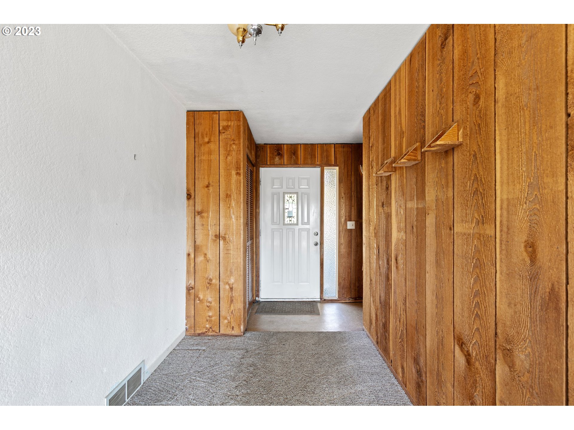 734 Summit Boulevard Springfield, OR 97477 - Photo 8 of 41 a view of an entryway with wooden wall