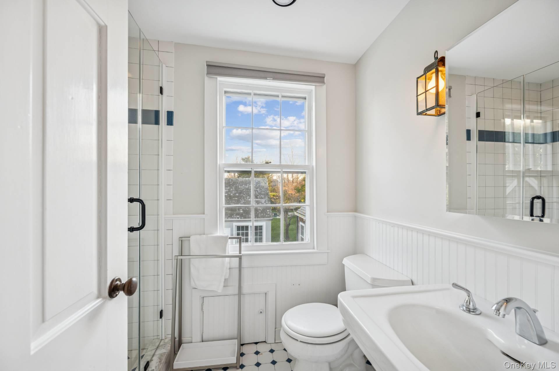 94 Post Lane Southampton, NY 11968 - Photo 16 of 34 a bathroom with a sink toilet and shower