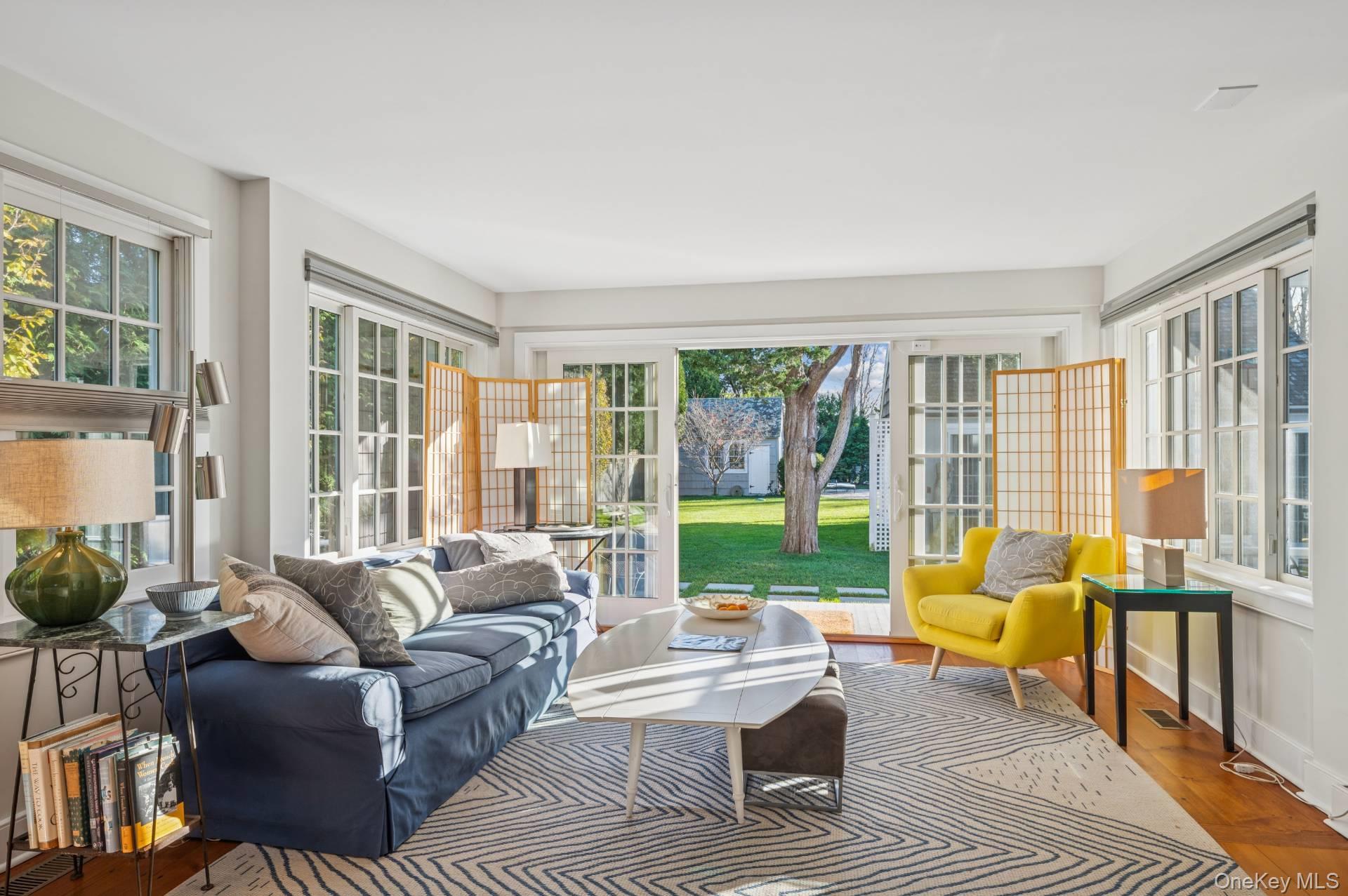 94 Post Lane Southampton, NY 11968 - Photo 22 of 34 a living room with furniture and a large window