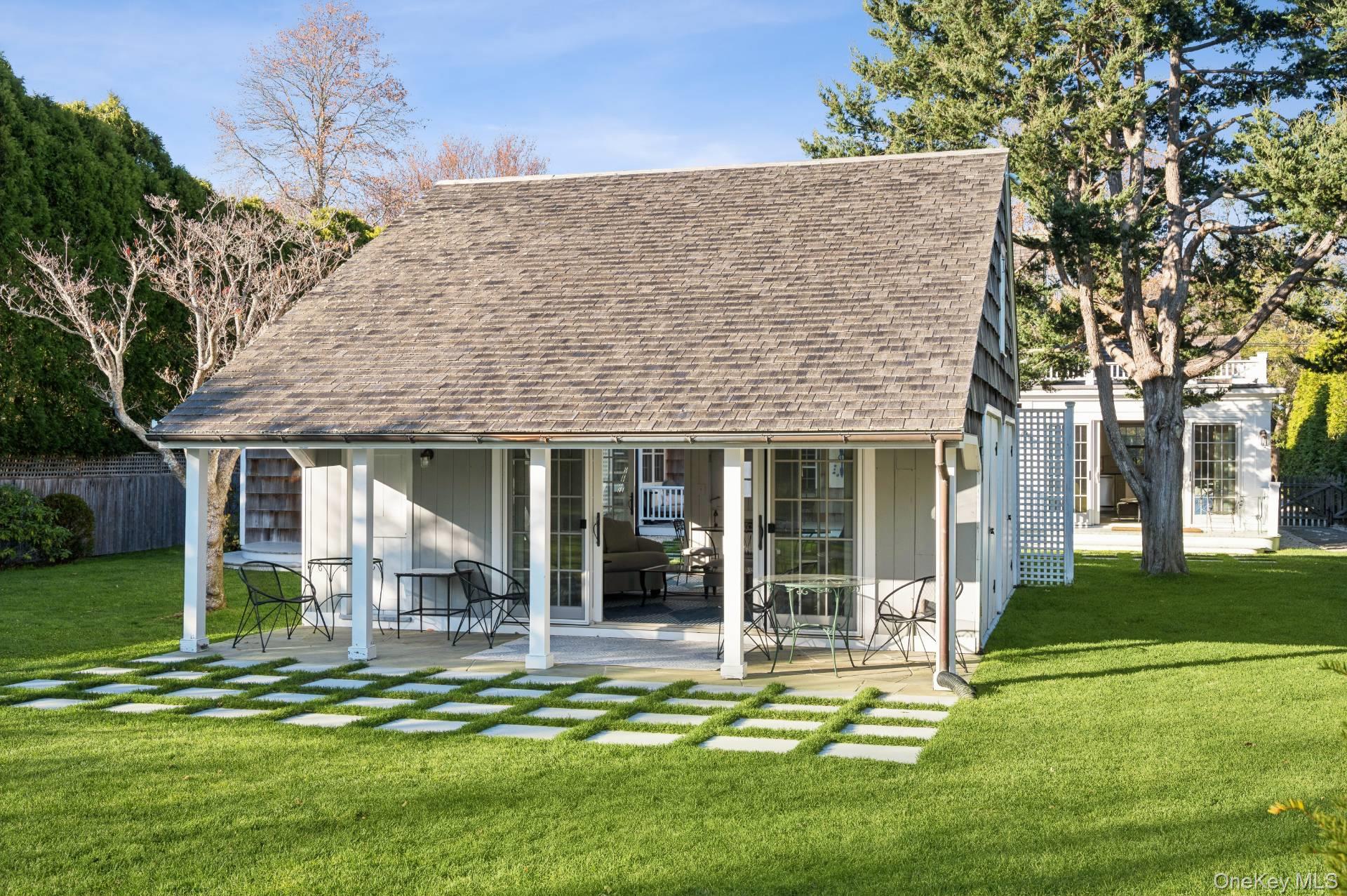 94 Post Lane Southampton, NY 11968 - Photo 27 of 34 front view of a house with a yard