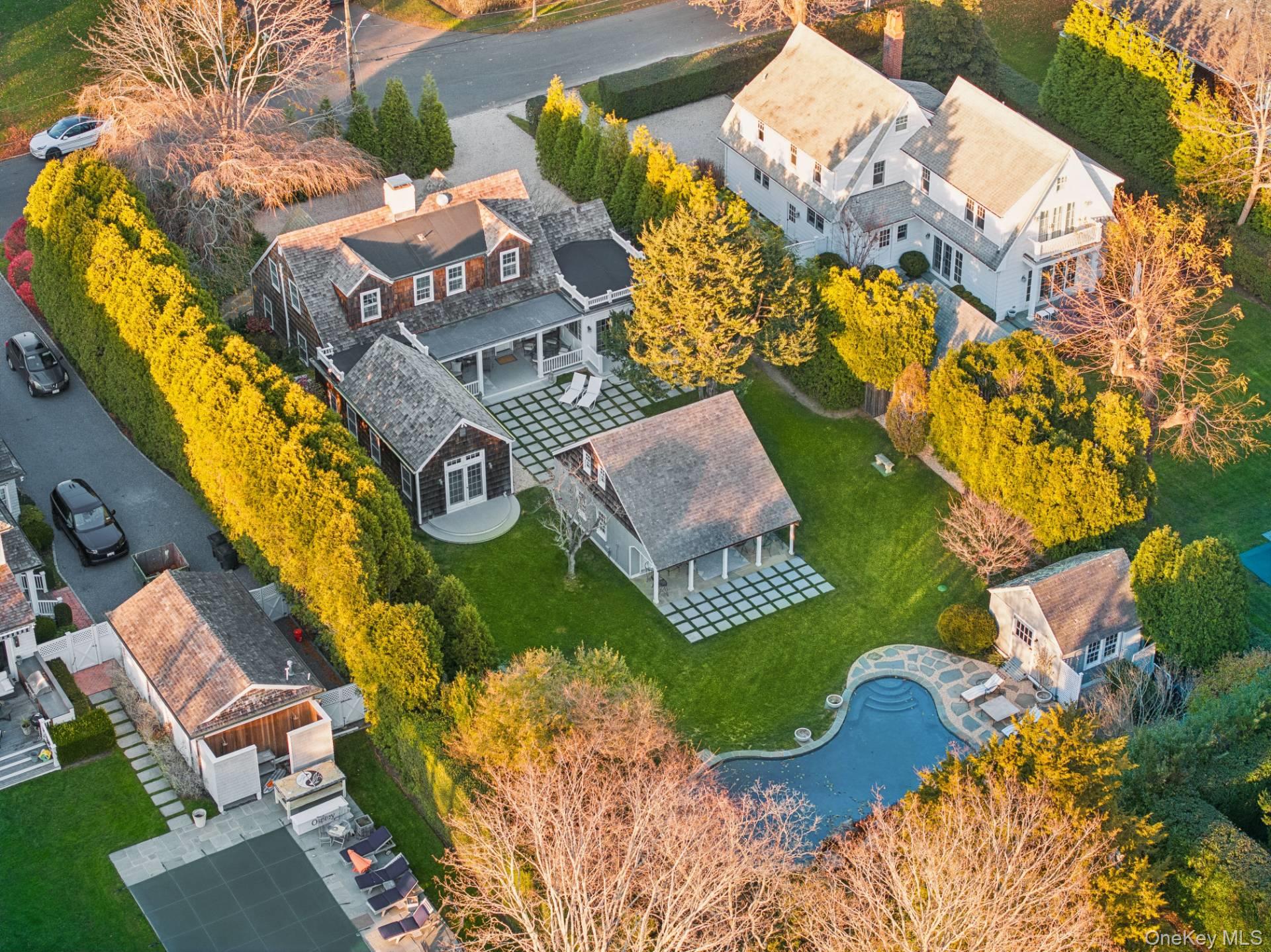 94 Post Lane Southampton, NY 11968 - Photo 3 of 34 an aerial view of a house with a swimming pool and outdoor seating