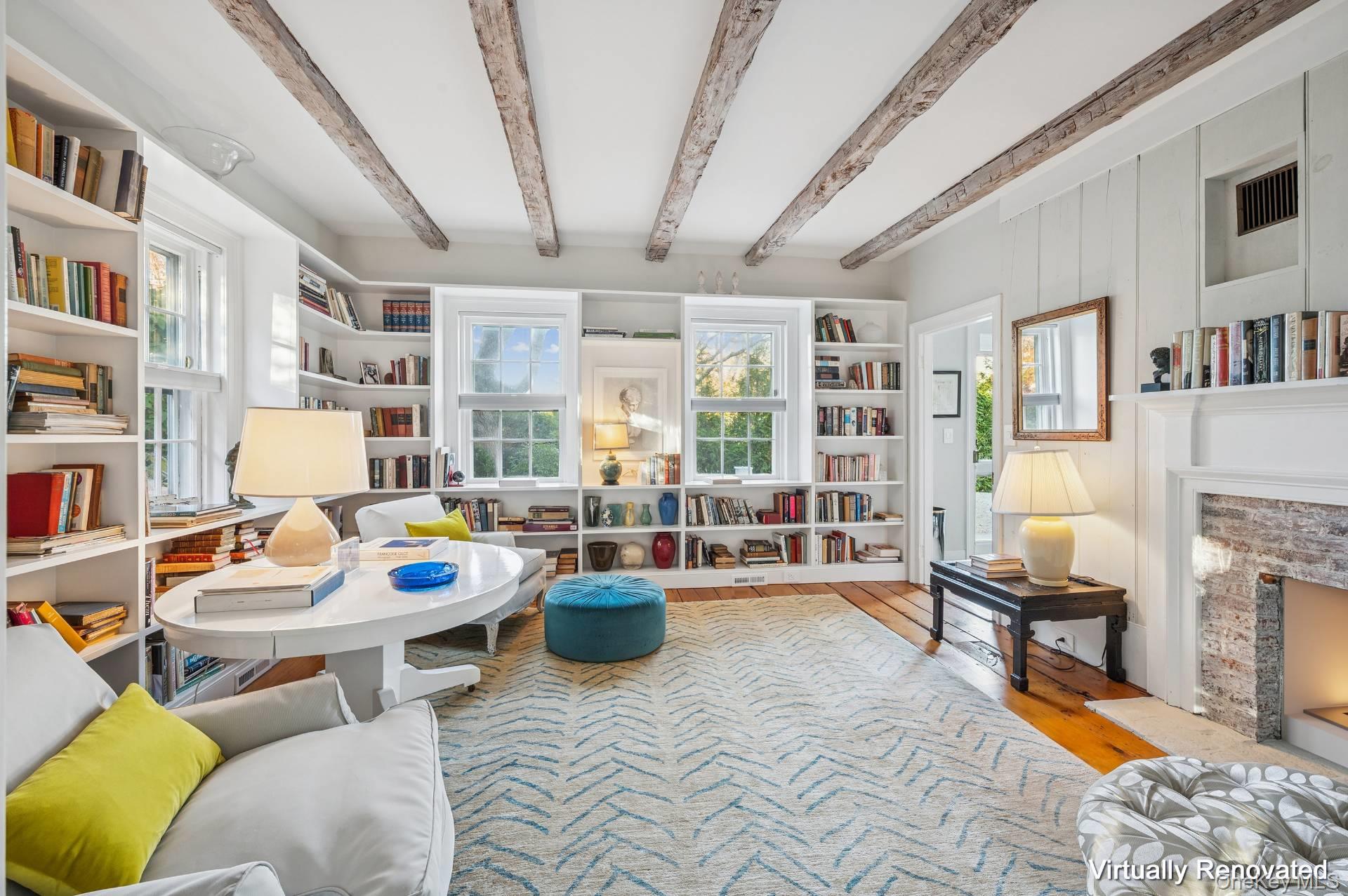 94 Post Lane Southampton, NY 11968 - Photo 7 of 34 a living room with furniture and a book shelf
