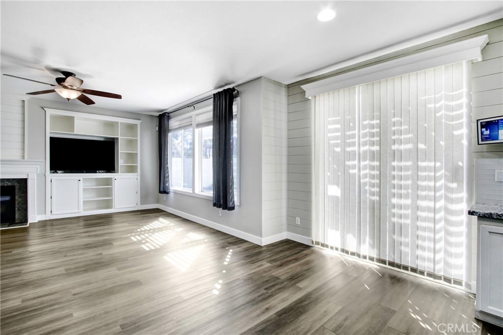 32509 Sunnyvail Circle Temecula, CA 92592 - Photo 13 of 38 a view of a flat screen tv with wooden floor