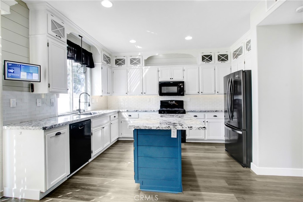32509 Sunnyvail Circle Temecula, CA 92592 - Photo 14 of 38 a kitchen with stainless steel appliances a refrigerator sink and microwave