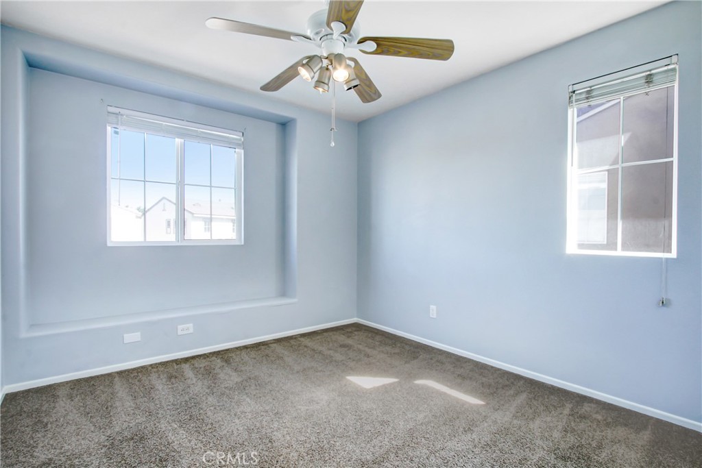32509 Sunnyvail Circle Temecula, CA 92592 - Photo 15 of 38 an empty room with windows and fan