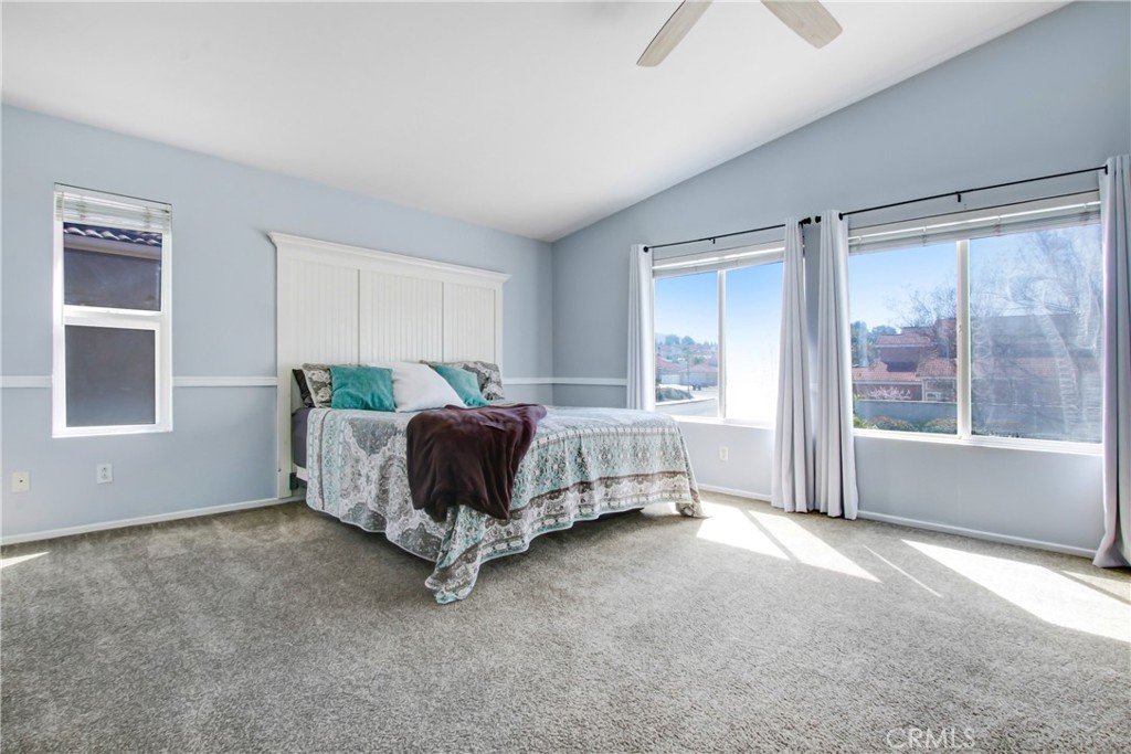 32509 Sunnyvail Circle Temecula, CA 92592 - Photo 23 of 38 a spacious bedroom with a bed and window