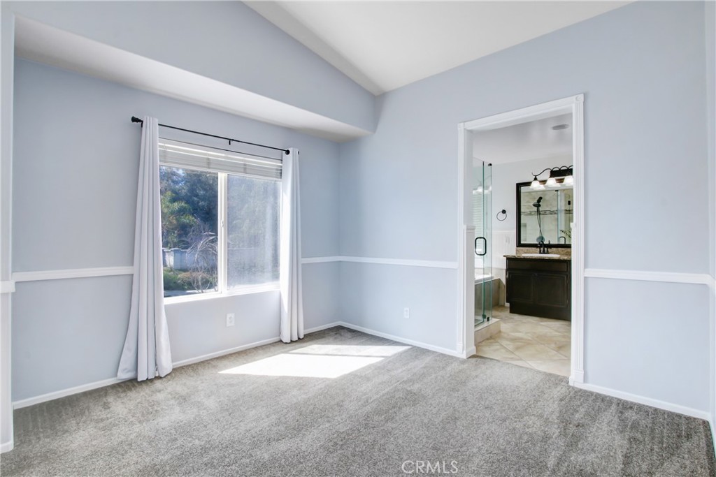 32509 Sunnyvail Circle Temecula, CA 92592 - Photo 27 of 38 an empty room that has a window and kitchen view
