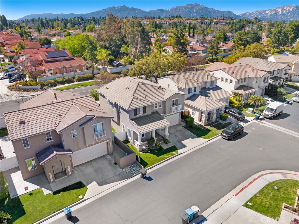 32509 Sunnyvail Circle Temecula, CA 92592 - Photo 37 of 38 an aerial view of residential house with outdoor space and parking