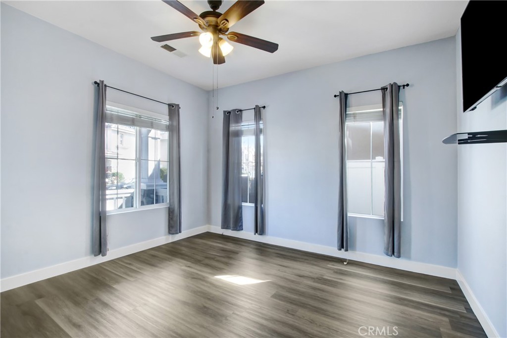 32509 Sunnyvail Circle Temecula, CA 92592 - Photo 4 of 38 a view of empty room with wooden floor and fan