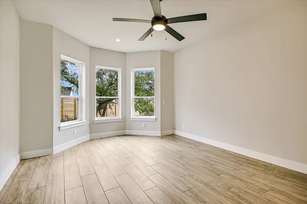 a view of a kitchen with a sink wooden floor and windows