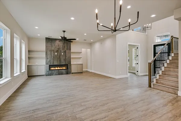 a kitchen with stainless steel appliances granite countertop a kitchen island a stove and a sink