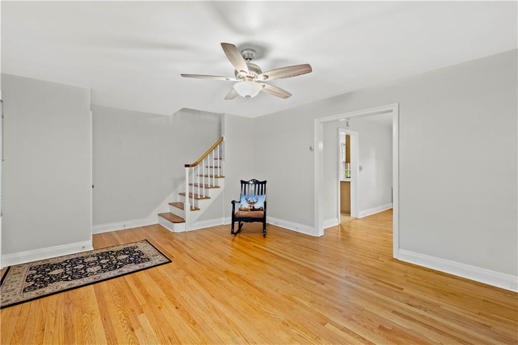 604 Olympia Road Pittsburgh, PA 15211 - Photo 8 of 34 a view of an empty room with wooden floor