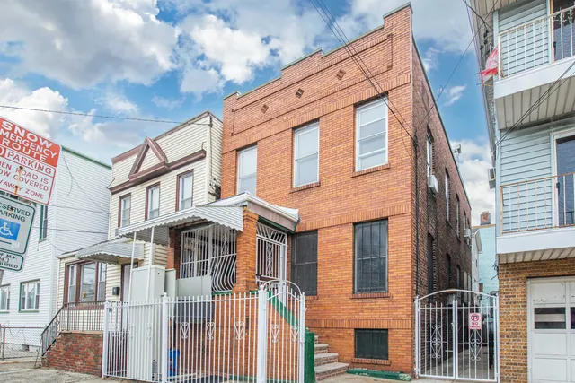 a front view of a multi story residential apartment building