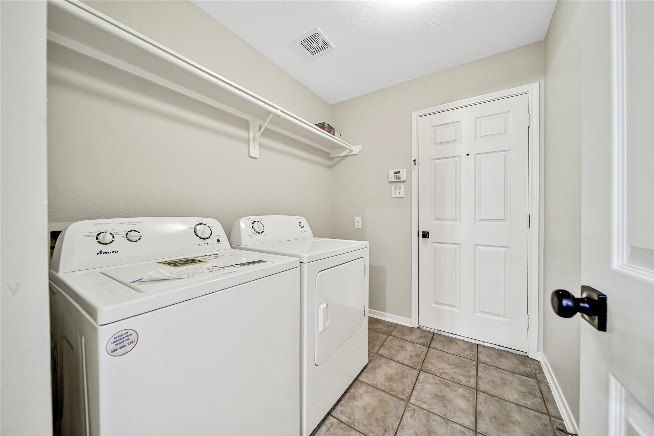 14526 Red Tailed Hawk Lane Houston, TX 77044 - Photo 31 of 40 a utility room with dryer and washer