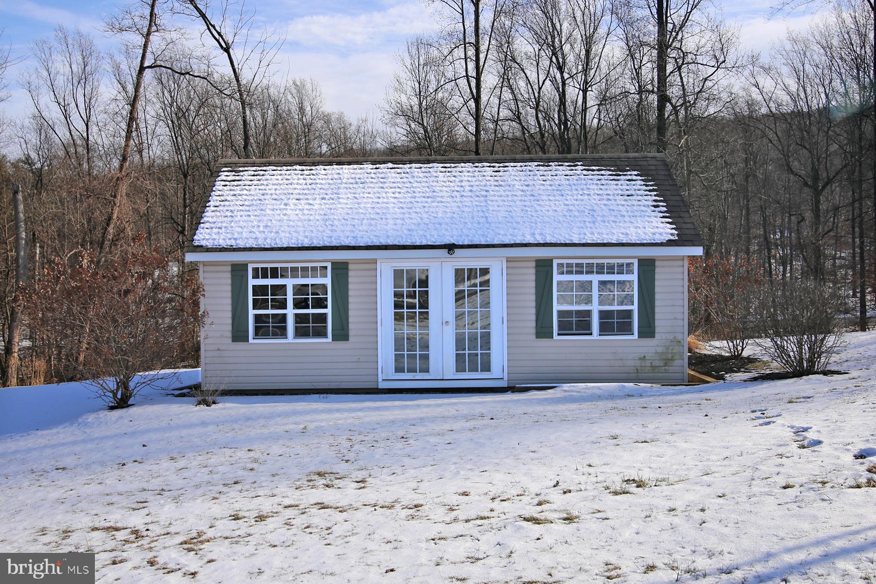 805 Mt Wilson Road Lebanon, PA 17042 - Photo 16 of 67 a front view of a house with a yard covered with snow and trees