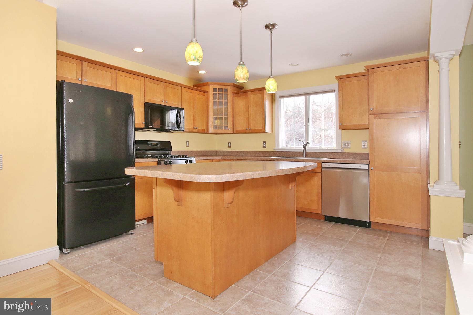 805 Mt Wilson Road Lebanon, PA 17042 - Photo 20 of 67 a kitchen with stainless steel appliances granite countertop a refrigerator a sink a stove and white cabinets