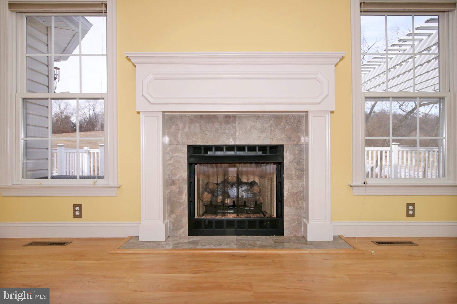 805 Mt Wilson Road Lebanon, PA 17042 - Photo 23 of 67 a living room with a fireplace and windows