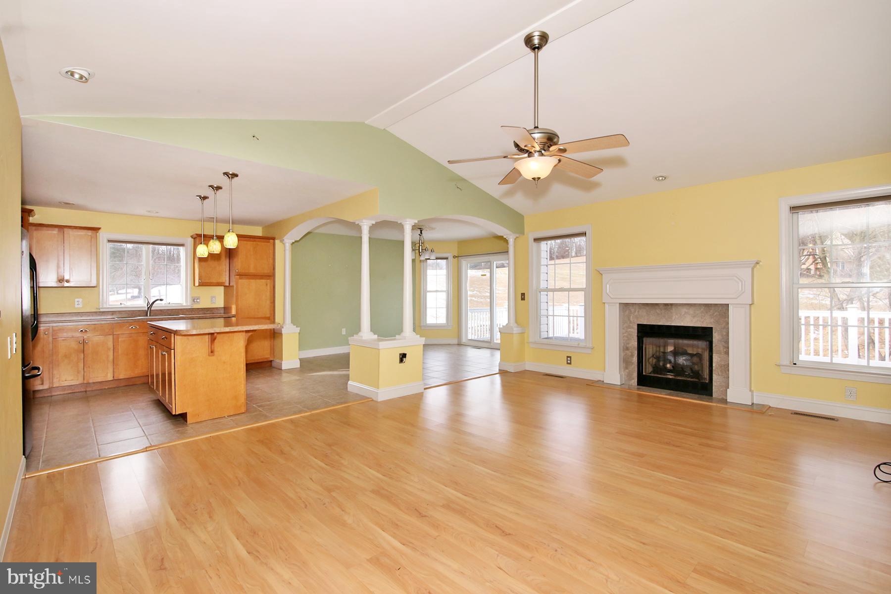 805 Mt Wilson Road Lebanon, PA 17042 - Photo 26 of 67 a view of a livingroom with a fireplace and chandelier fan