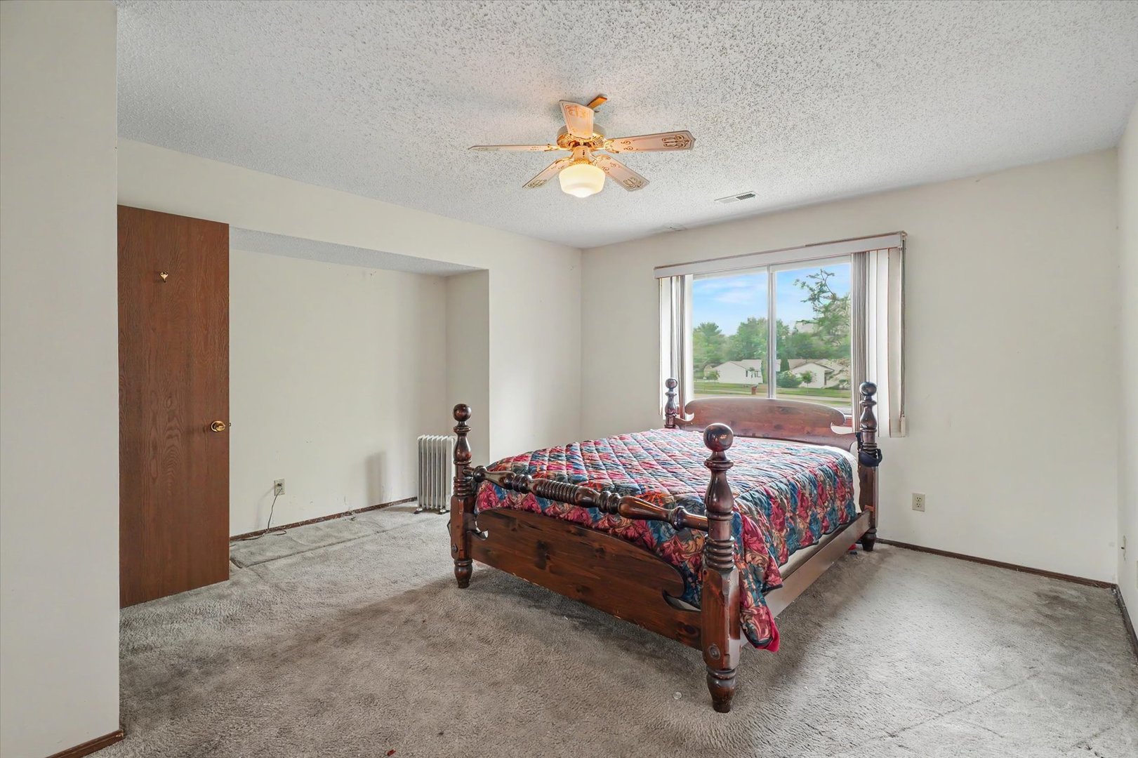 711 Higgins Road Champaign, IL 61822 - Photo 16 of 23 a bed sitting in a bedroom next to a window