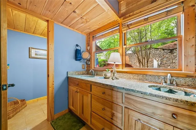 a bathroom with a sink and a window