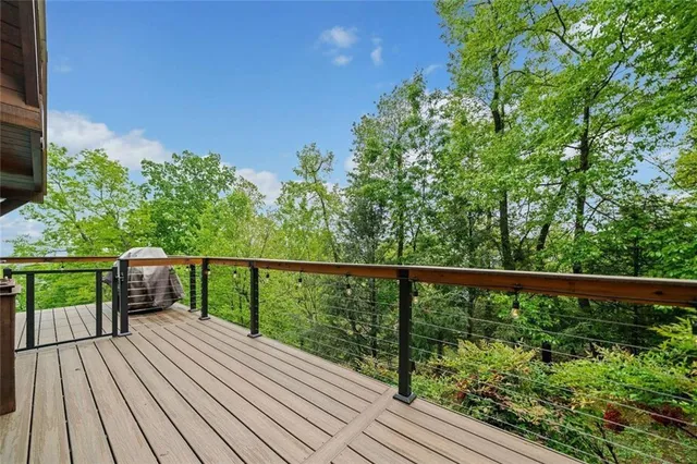 a view of balcony with wooden floor