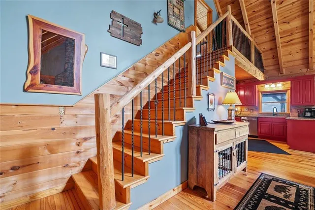 a view of an entryway with wooden floor