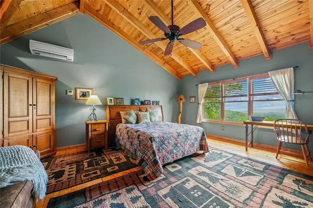 a bedroom with furniture and a window