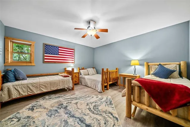 a bedroom with bed and window