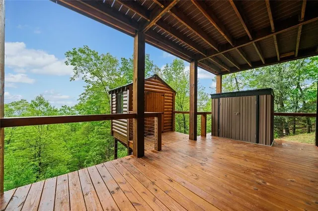 a view of a balcony with wooden floor