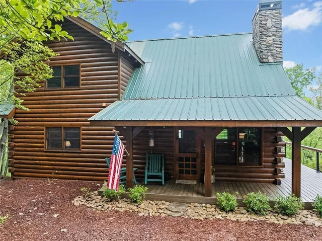 a view of a house with porch and sitting area