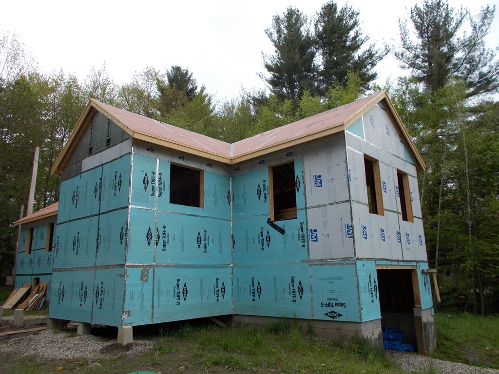 a view of front of house with large windows