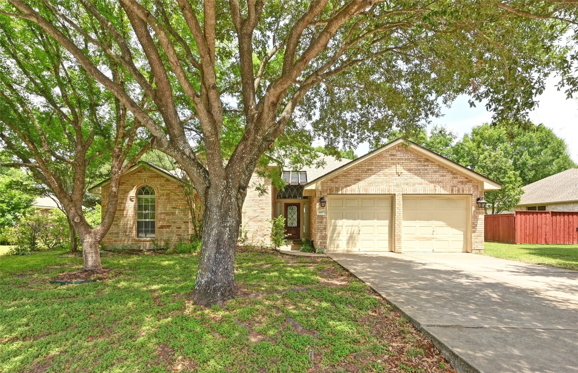 607 Prickly Pear Pass Buda, TX 78610 - Photo 1 of 1 front view of a house with a yard
