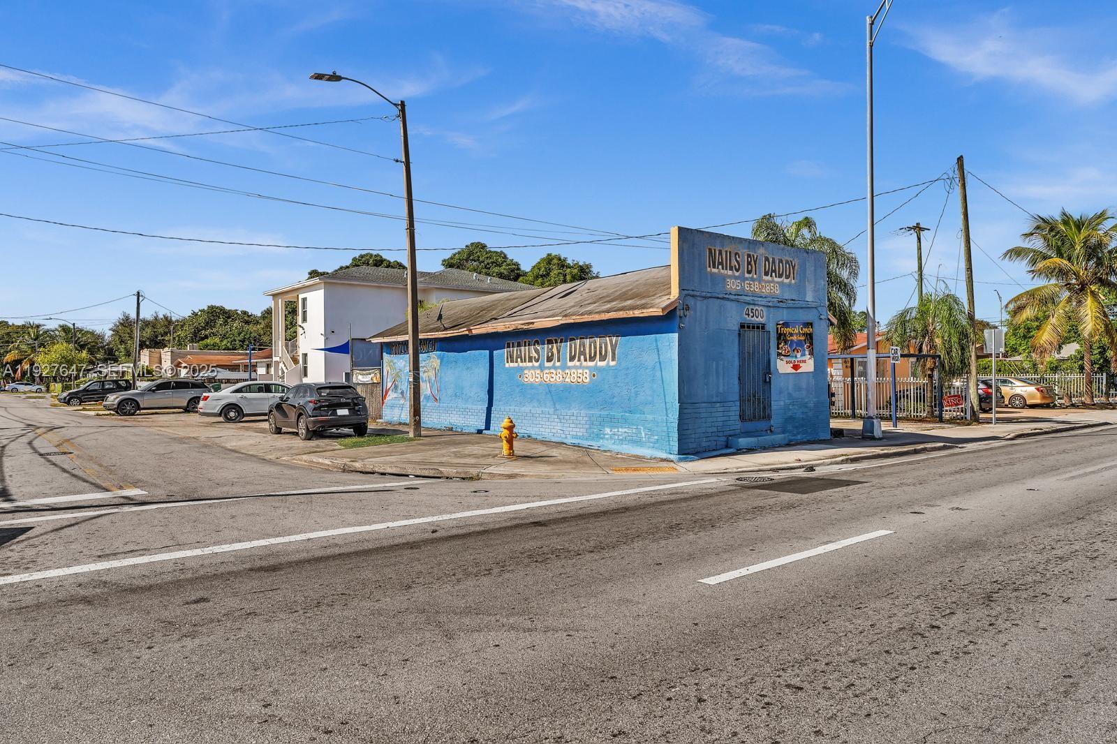 4500 Northwest 12th Avenue Miami, FL 33142 - Photo 1 of 16 a street sign on a sidewalk next to a road
