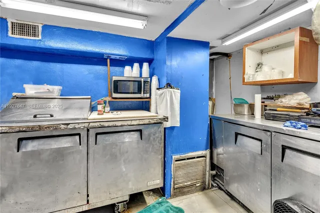 a bathroom with a sink mirror and toilet