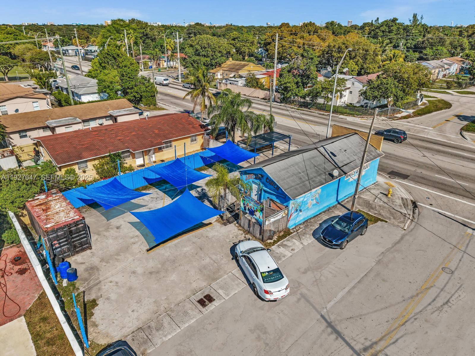 4500 Northwest 12th Avenue Miami, FL 33142 - Photo 9 of 16 an aerial view of a pool patio outdoor seating and outdoor kitchen view