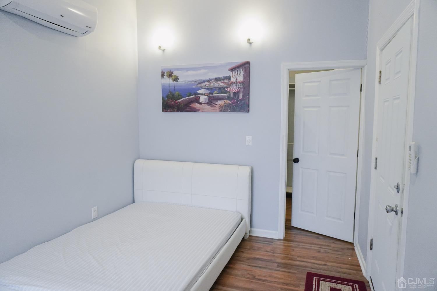 140 Meredith Road Colonia, NJ 07067 - Photo 12 of 30 a view of bedroom with wooden floor and window