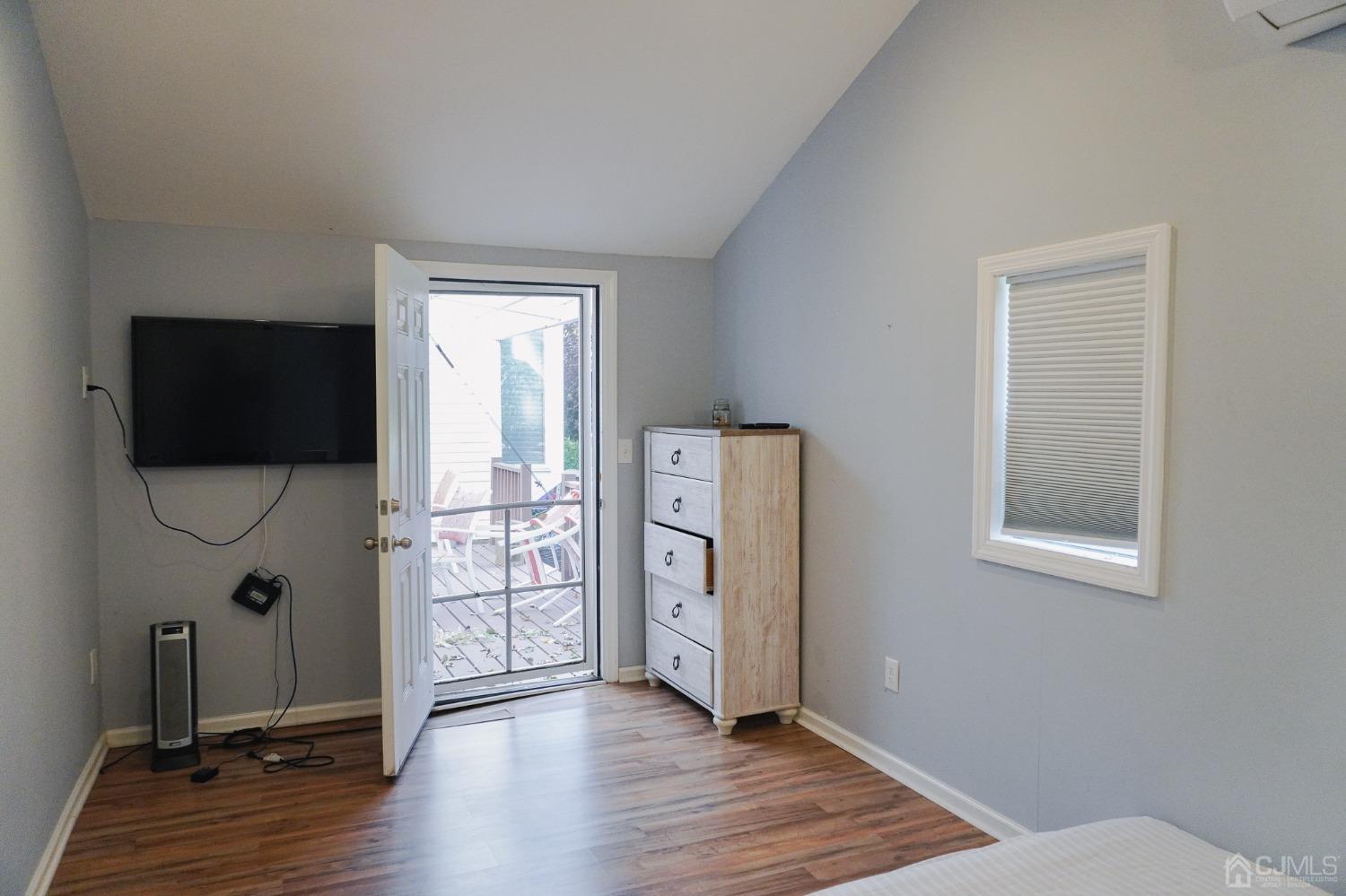 140 Meredith Road Colonia, NJ 07067 - Photo 13 of 30 a view of an empty room with window wooden floor and windows