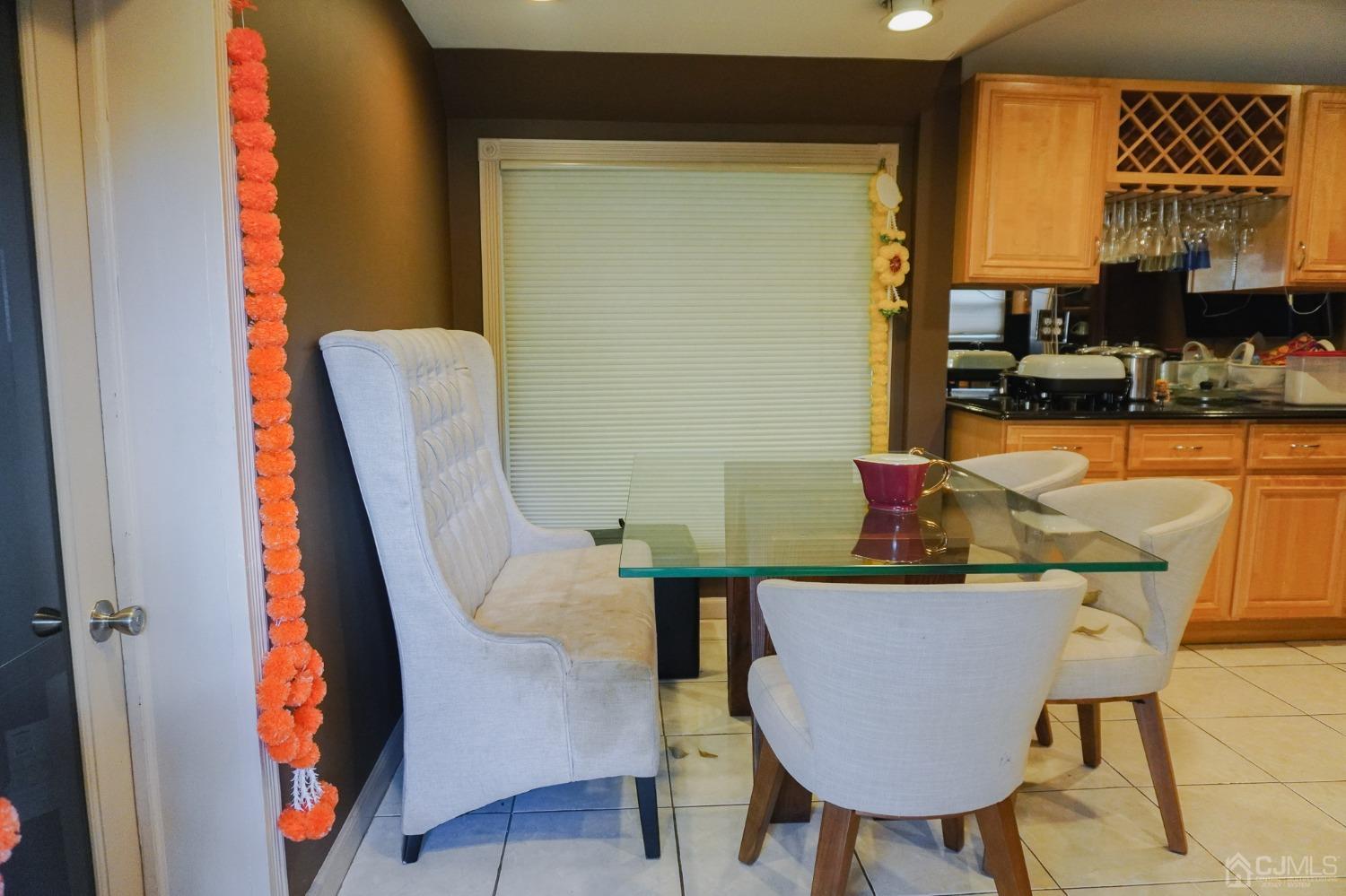 140 Meredith Road Colonia, NJ 07067 - Photo 4 of 30 a balcony with table and chairs