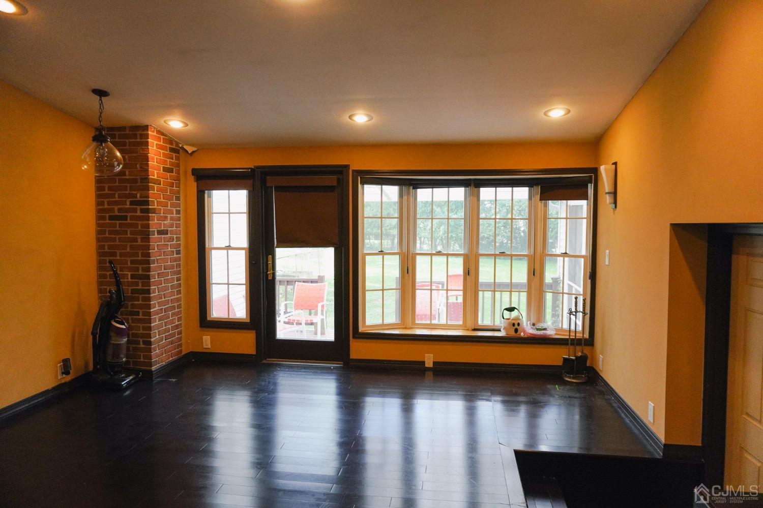 140 Meredith Road Colonia, NJ 07067 - Photo 10 of 30 a view of an empty room with a window and wooden floor