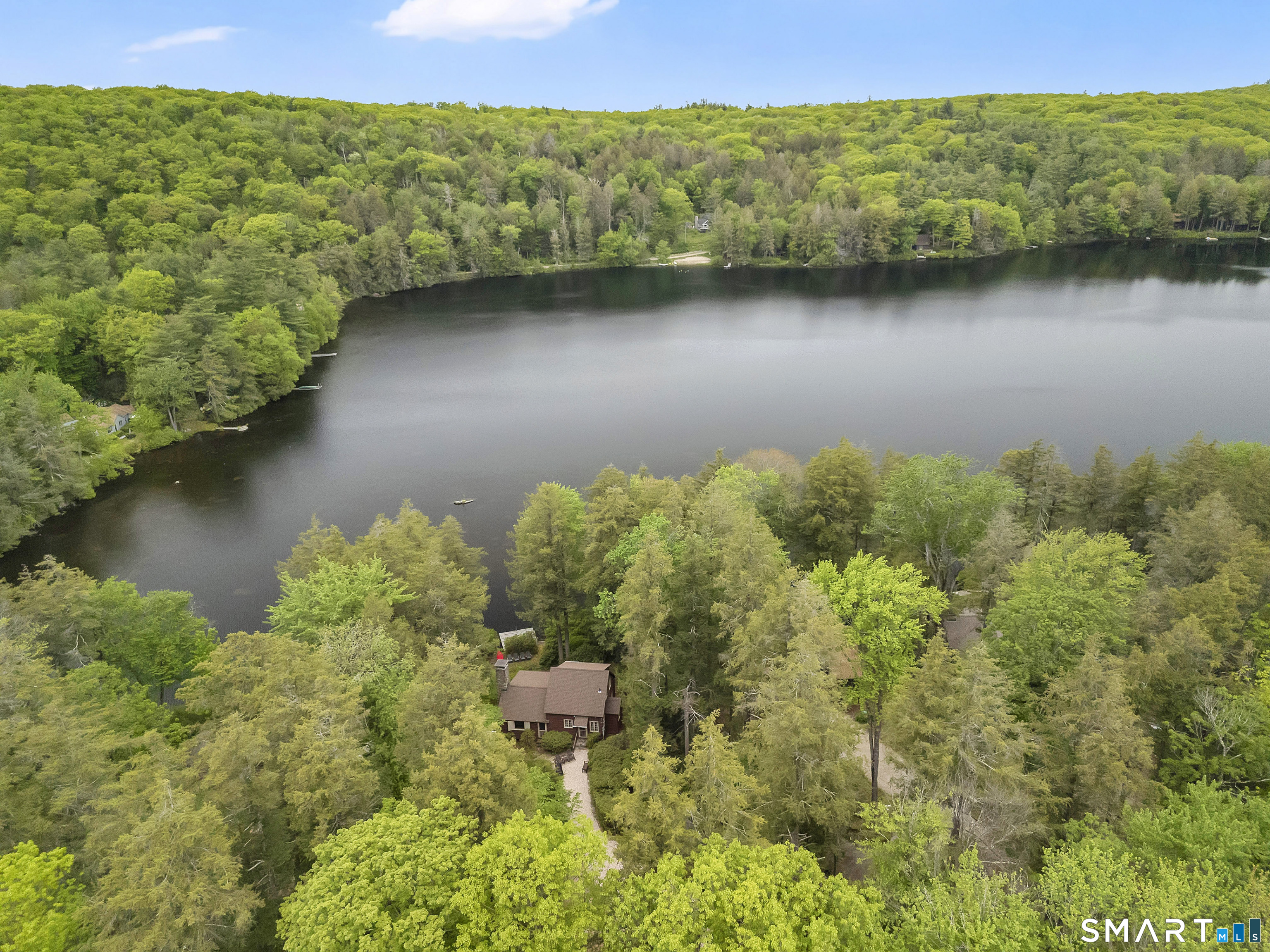 47 Pinehurst Road Hartland, CT 06091 - Photo 2 of 39 a view of a lake with a mountain in the background