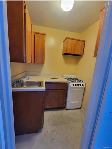 a room with cabinets and wooden floor