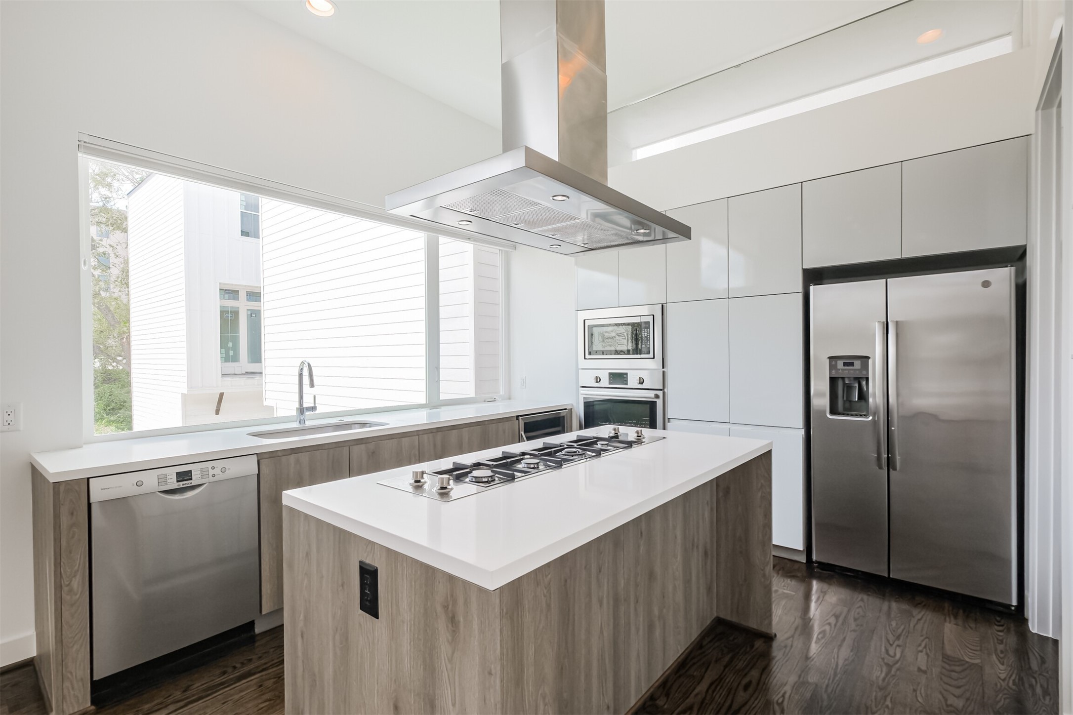 1157 West 18th Street Houston, TX 77008 - Photo 11 of 41 a kitchen with a sink a stove a refrigerator and a window